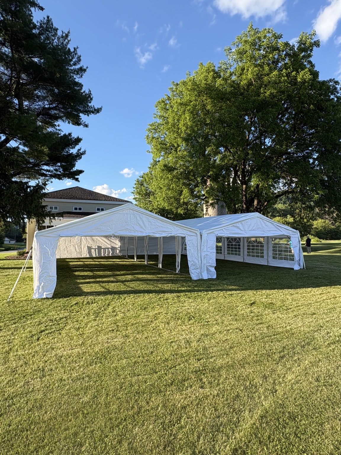 White event tents on a lawn