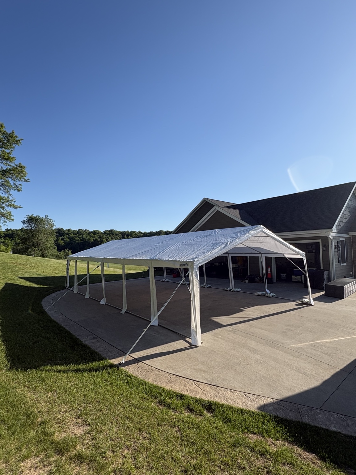 Tent set up beside a building